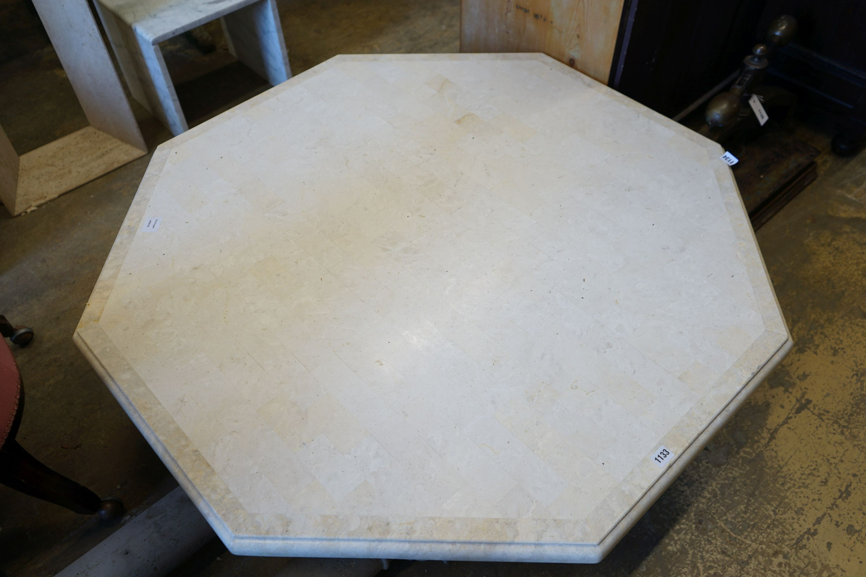 A large contemporary octagonal reconstituted marble coffee table, width 120cm height 38cm